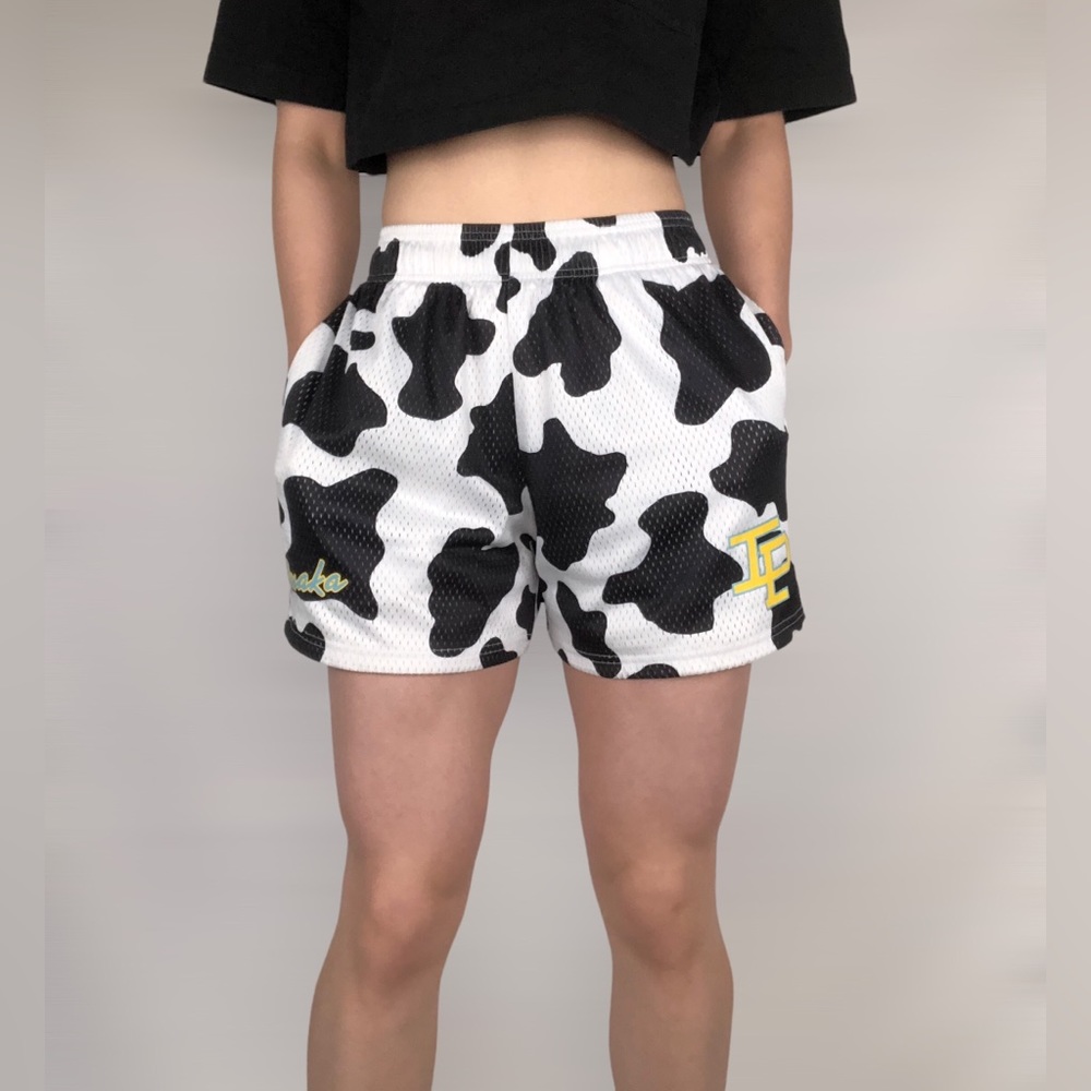 Inaka Power Black and White Cow Print Athletic Shorts with Yellow Logo